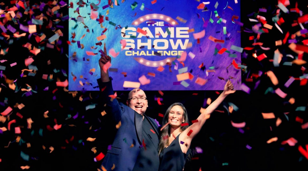 Brickeys and a beautiful lady amidst a shower of confetti in a game show